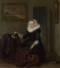 Репродукция картины "a woman holding a mirror" художника "кодде питер"