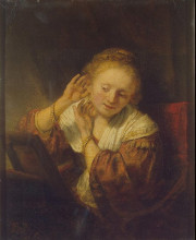 Картина "young woman trying earrings" художника "рембрандт"